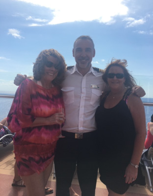 Pam with the Captain of the Celebrity Reflection on Med Cruise